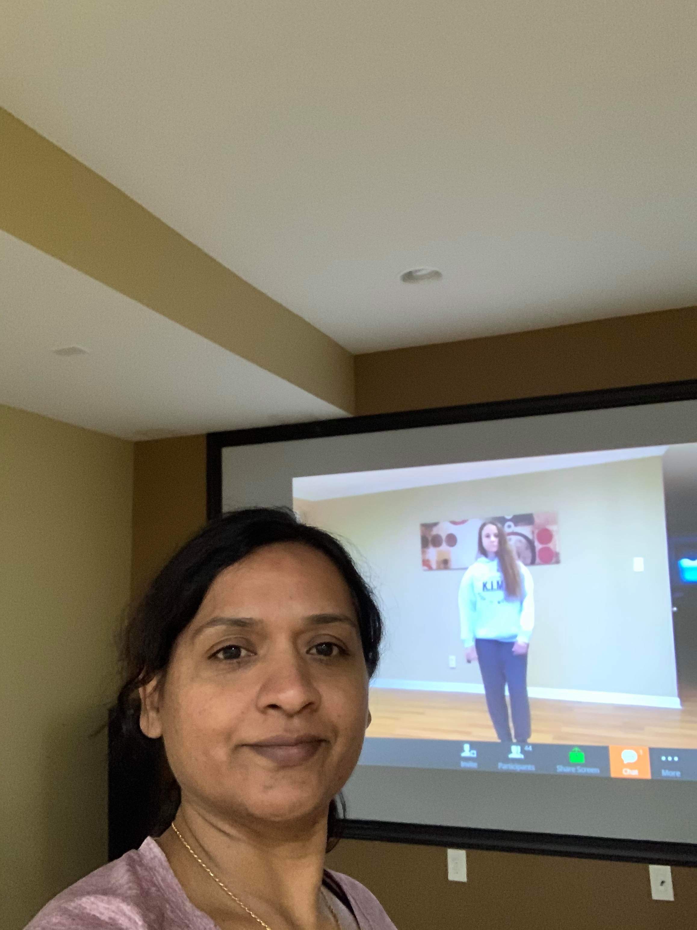 Personal training customer following along on screen